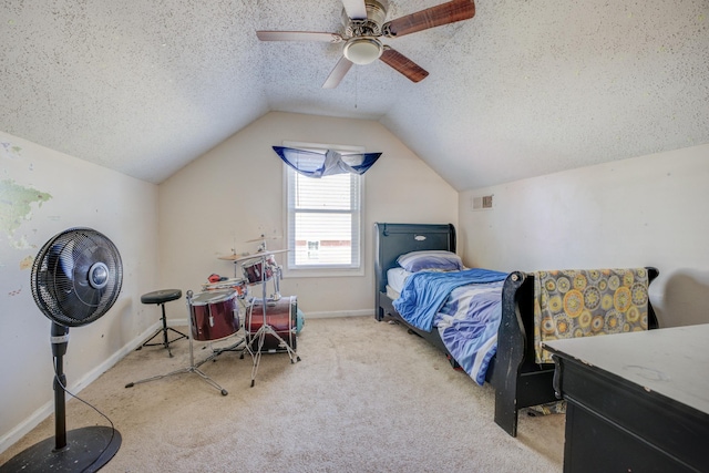 bedroom featuring carpet floors, lofted ceiling, visible vents, a ceiling fan, and a textured ceiling