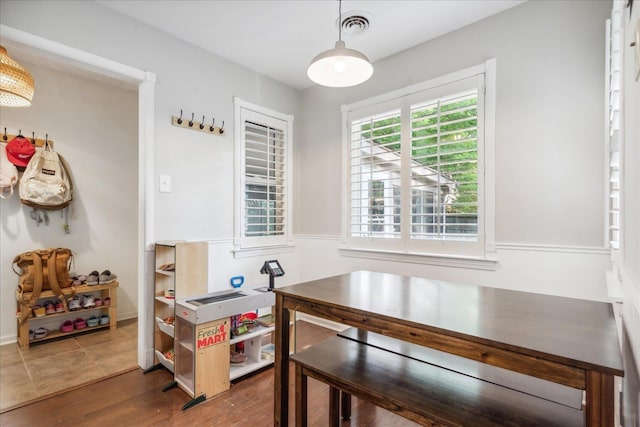 dining space featuring wood finished floors and visible vents