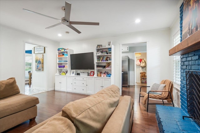 living area with recessed lighting, a brick fireplace, ceiling fan, and dark wood-style flooring