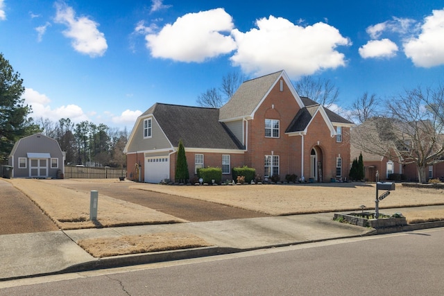 view of front of home with a shed, fence, and brick siding