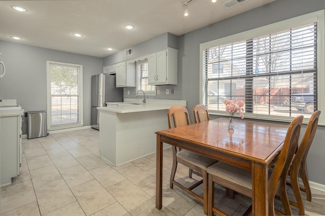 dining area featuring light tile patterned flooring, visible vents, baseboards, and recessed lighting