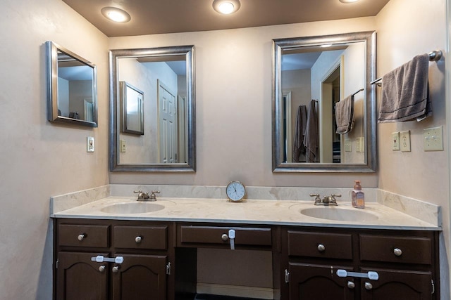 bathroom with double vanity and a sink