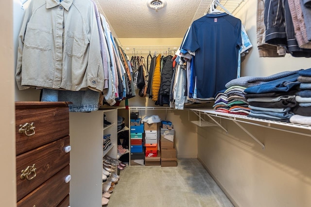 spacious closet featuring visible vents and carpet flooring