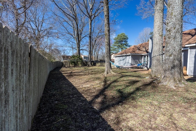 view of yard with a fenced backyard