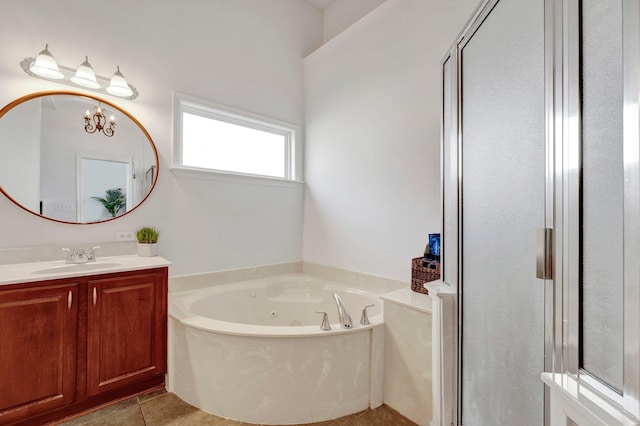 full bath with a jetted tub, vanity, a shower stall, and tile patterned floors