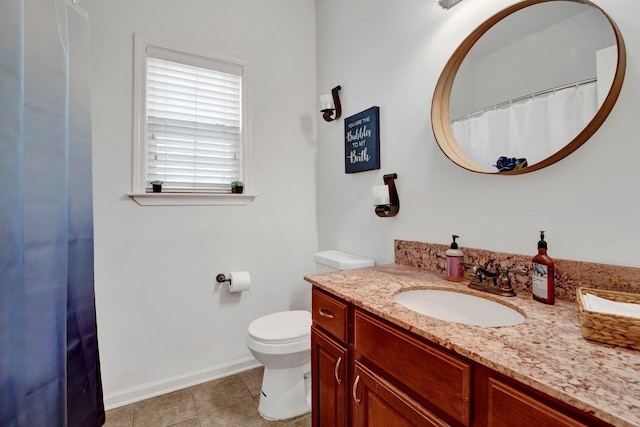 full bath featuring toilet, baseboards, vanity, and tile patterned floors