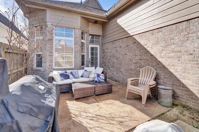 view of patio with an outdoor hangout area and fence