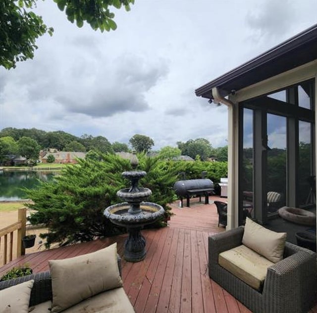 wooden deck with a water view