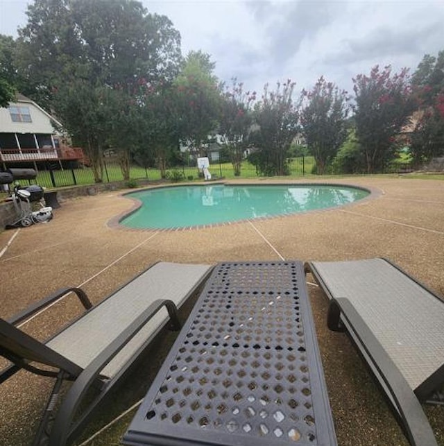 view of swimming pool with a fenced in pool, a patio area, and fence