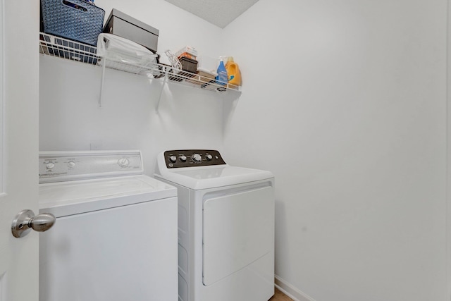 laundry area featuring laundry area and separate washer and dryer