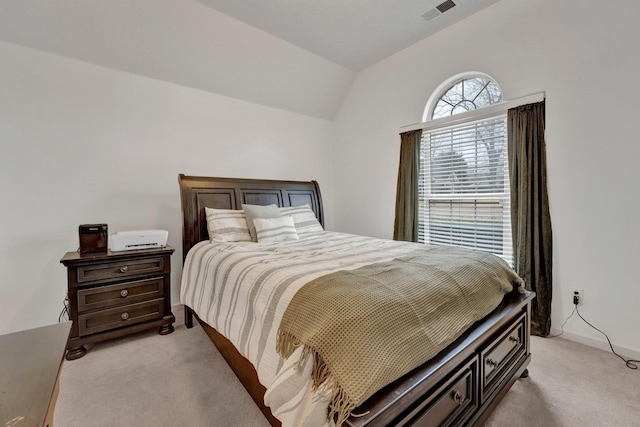 bedroom featuring light colored carpet, vaulted ceiling, visible vents, and baseboards