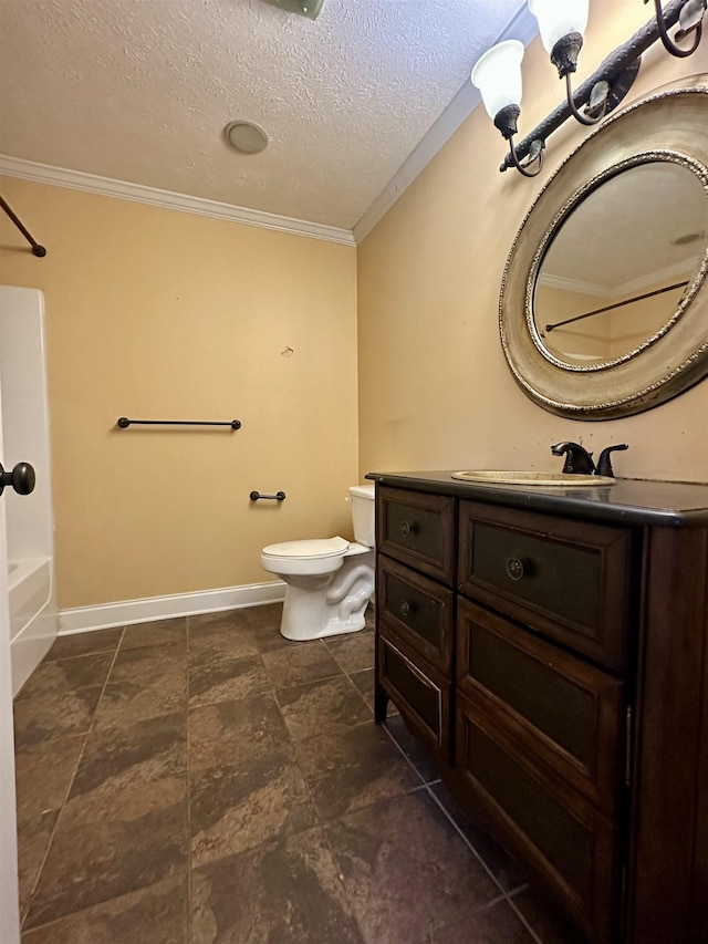 bathroom with crown molding, toilet, vanity, a textured ceiling, and baseboards