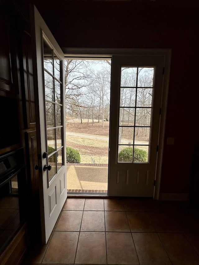 doorway with tile patterned floors