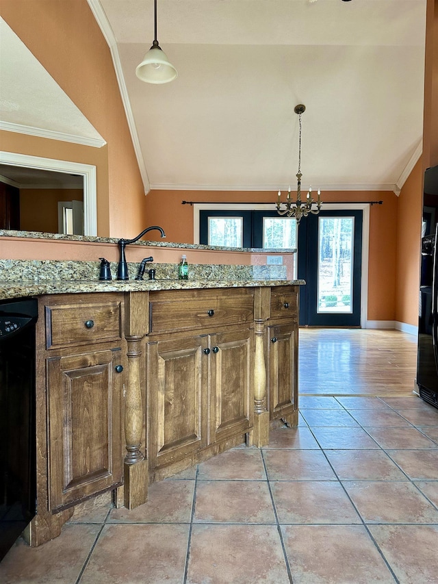 kitchen featuring ornamental molding, vaulted ceiling, black appliances, and light tile patterned floors