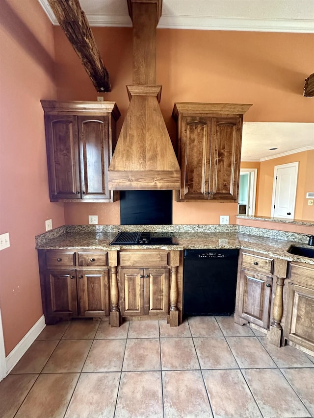 kitchen featuring light tile patterned floors, a sink, baseboards, ornamental molding, and black appliances