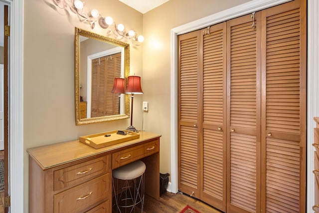 interior space with wood finished floors and vanity