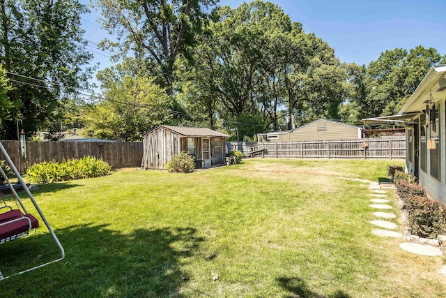 view of yard featuring an outbuilding and a fenced backyard