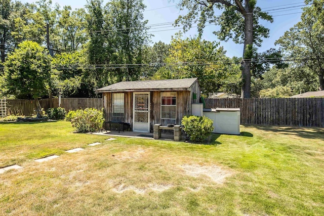 view of outbuilding featuring an outbuilding and a fenced backyard