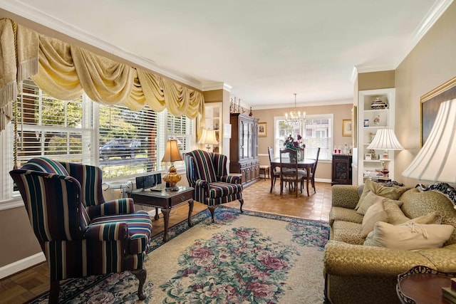 living area with baseboards, ornamental molding, built in shelves, and a notable chandelier