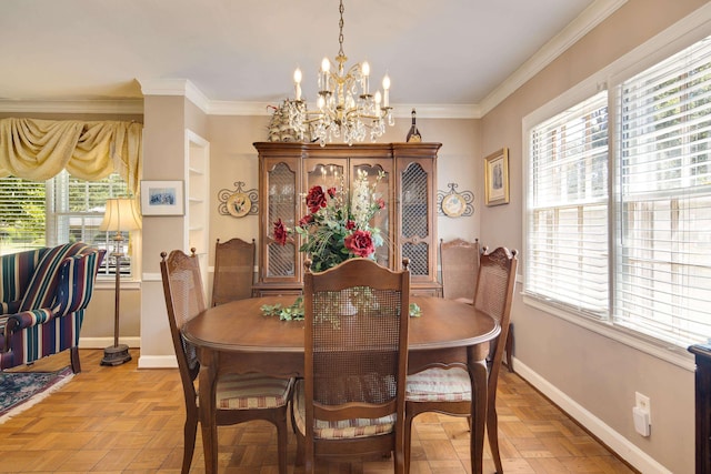 dining space with ornamental molding, a chandelier, and baseboards