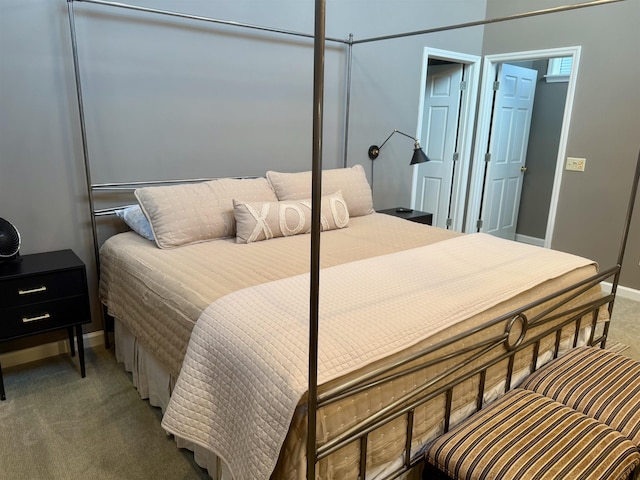 bedroom with carpet and baseboards