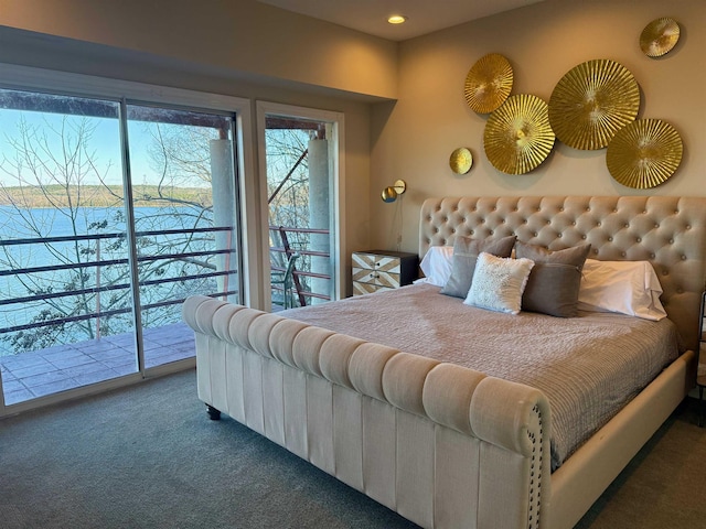 carpeted bedroom with access to exterior