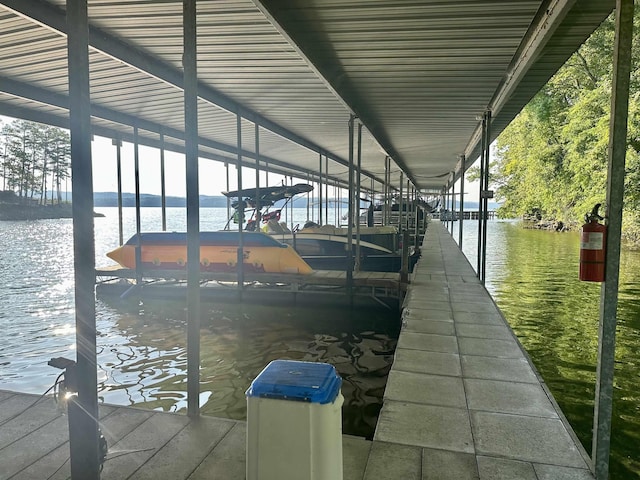 dock area featuring a water view and boat lift