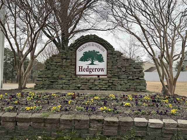 community sign with fence