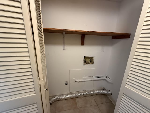 clothes washing area with laundry area, washer hookup, and tile patterned floors