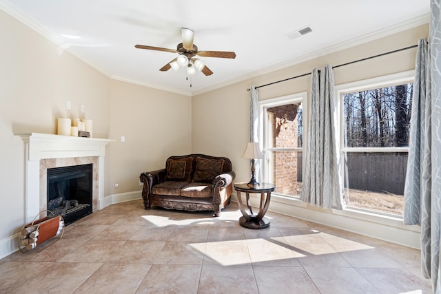 14029 Knightsbridge Ln, Olive Branch, MS 38654 - living area featuring baseboards, visible vents, a ceiling fan, crown molding, and a fireplace