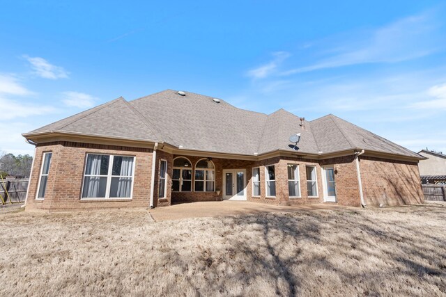 14029 Knightsbridge Ln, Olive Branch, MS 38654 - rear view of house featuring roof with shingles, fence, and brick siding