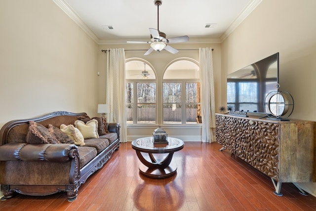 14029 Knightsbridge Ln, Olive Branch, MS 38654 - living area with ornamental molding, a ceiling fan, visible vents, and hardwood / wood-style flooring