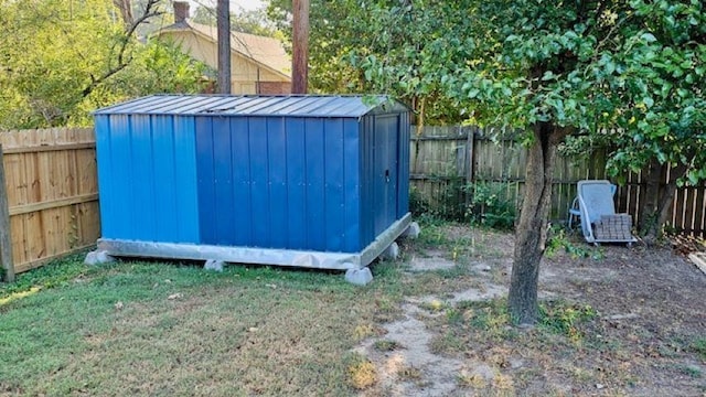 view of shed with a fenced backyard