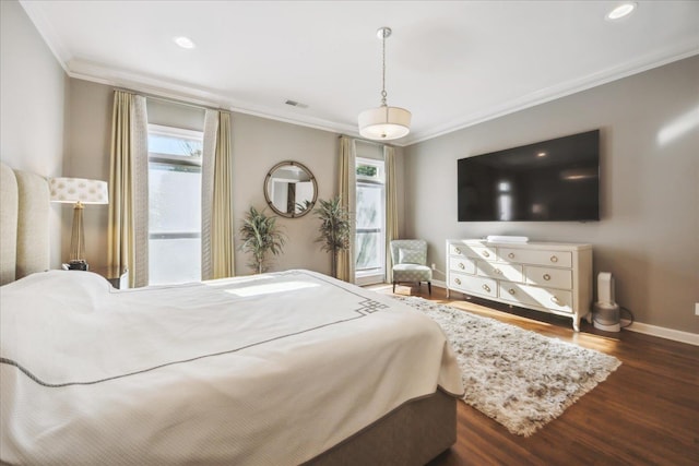 bedroom featuring baseboards, visible vents, ornamental molding, wood finished floors, and recessed lighting