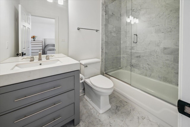 ensuite bathroom featuring marble finish floor, shower / bath combination with glass door, toilet, connected bathroom, and vanity