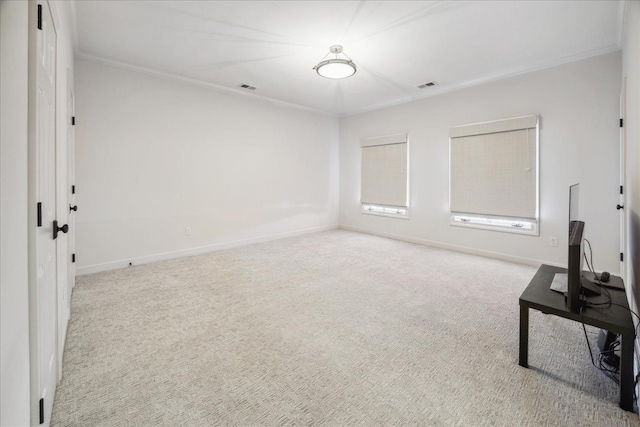 interior space featuring carpet floors, baseboards, visible vents, and ornamental molding