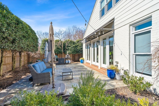 view of patio / terrace featuring fence