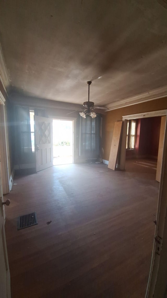 unfurnished room featuring visible vents and wood finished floors