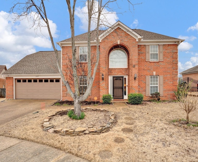 view of front facade with brick siding, concrete driveway, a garage, and roof with shingles