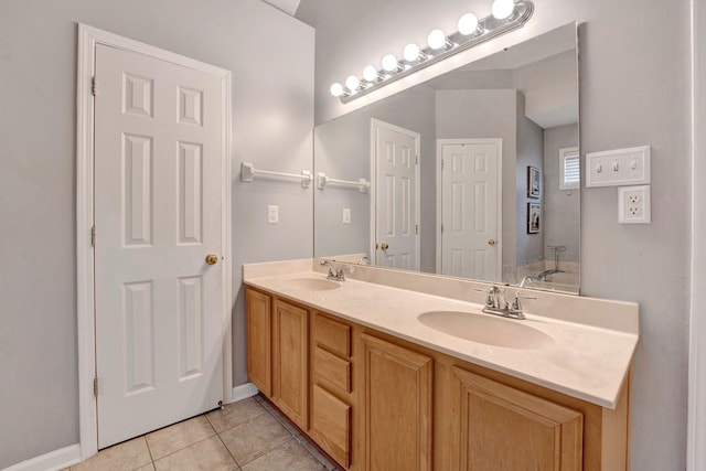 full bath featuring tile patterned flooring, double vanity, and a sink