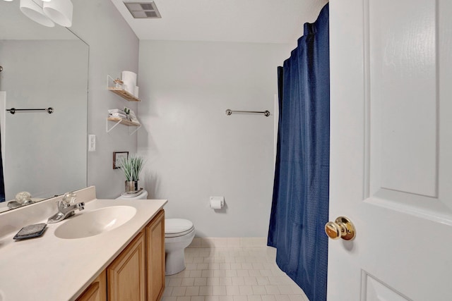 full bathroom with visible vents, toilet, curtained shower, tile patterned flooring, and vanity