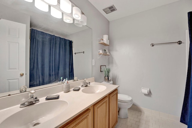 full bath with tile patterned floors, toilet, visible vents, and a sink