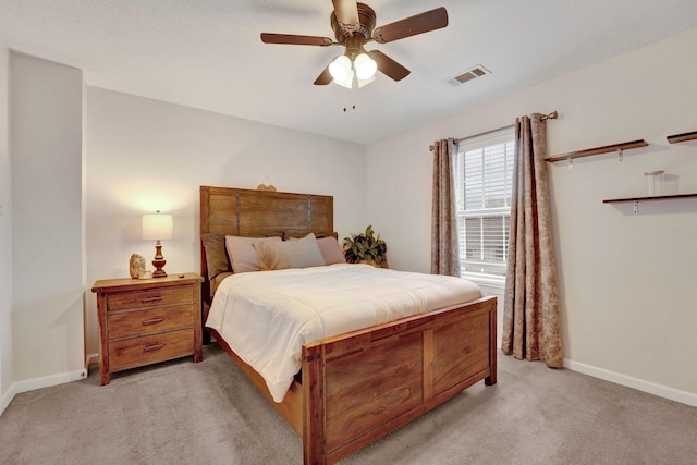 bedroom featuring light carpet, visible vents, ceiling fan, and baseboards