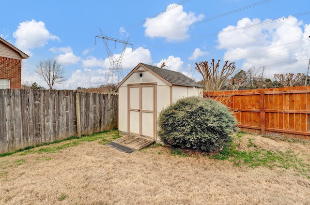 view of shed featuring a fenced backyard