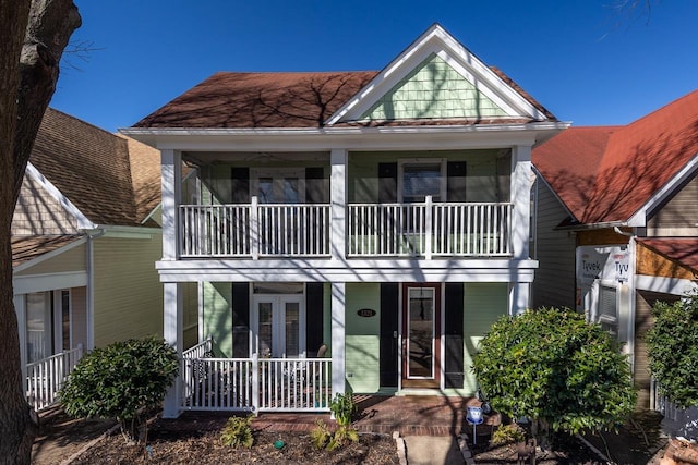 view of front facade featuring covered porch and a balcony