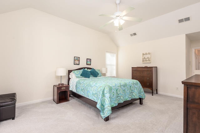 bedroom featuring vaulted ceiling, baseboards, visible vents, and light colored carpet