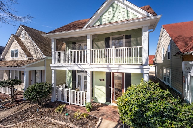 view of front of home with a balcony and a porch