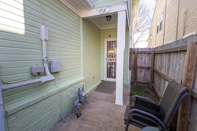 doorway to property with fence