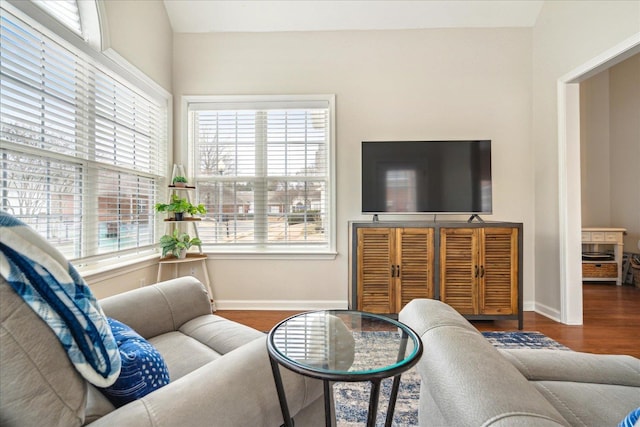 living area featuring wood finished floors and baseboards