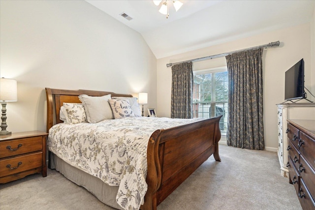 bedroom featuring lofted ceiling, baseboards, light carpet, and visible vents